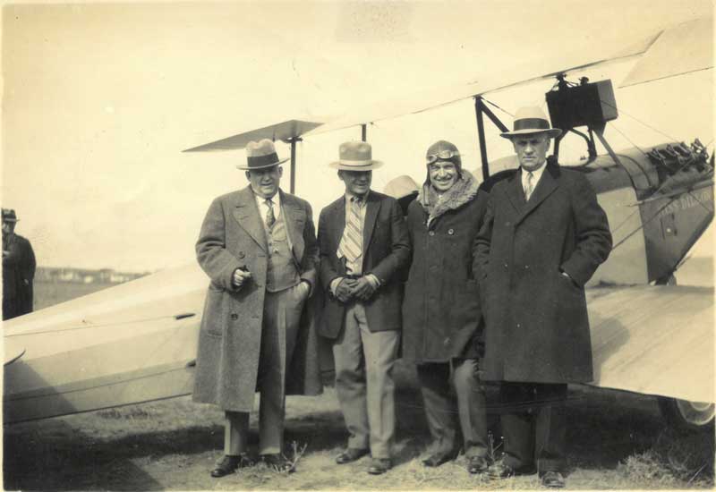 Will Rogers Arrives in Great Falls, March 1927 (L to R: Sid Willis, Charles Beil, Will Rogers, Frank Brown), black and white photograph. CMRM, gift of Jim Greenfield, 973-6-05
